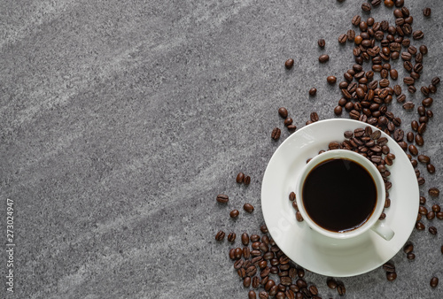 Top view of blcak Coffee cup with  cooffee bean on Marble table background. copy space photo