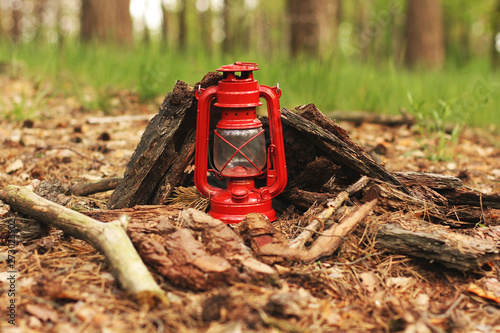 Kerosene lamp in the forest. Abstract photo