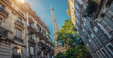 Paris street with view on the famous paris eiffel tower from rue de l'université on a sunny day with some sunshine