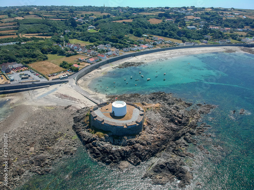 Aerial view Fort grey, built in 1804 to defend the west coast of Guernsey. wonderful beach with white sand and turquoise water and fisher boats 