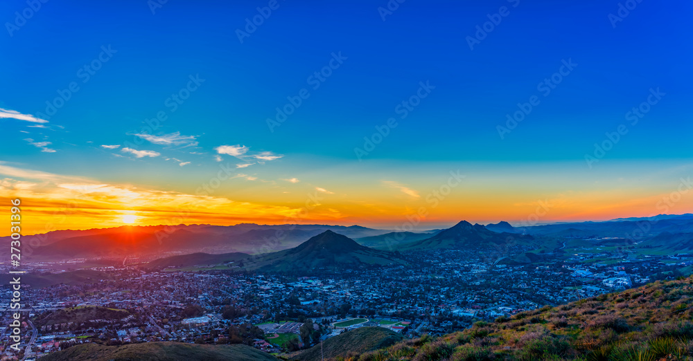 Sunset over City and Mountains