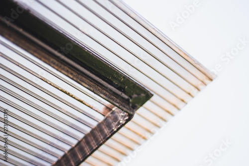 Polycarbonate stripped sheet on a metallic frame outdoor – Polymer based material for thermal protection - Modern transparent acrylic equipment used in construction photo