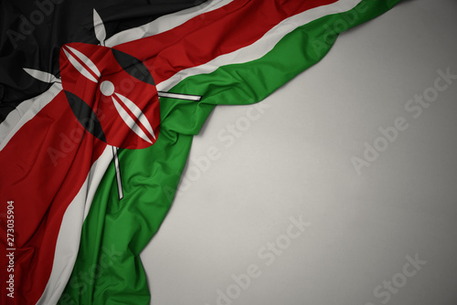 waving national flag of kenya on a gray background. photo