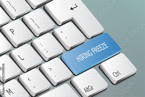 hiring freeze written on the keyboard button