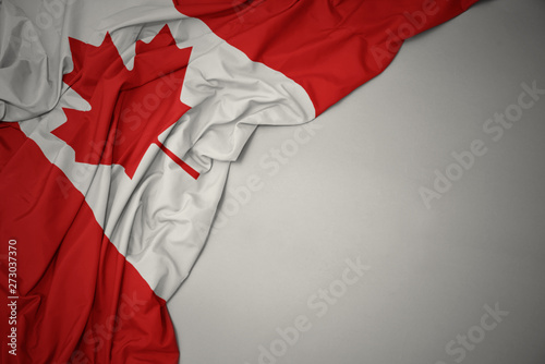 Cuadro en lienzo waving national flag of canada on a gray background.