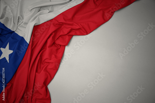 waving national flag of chile on a gray background. photo