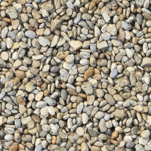 Large pebbles of different colors on the lake .Texture or background