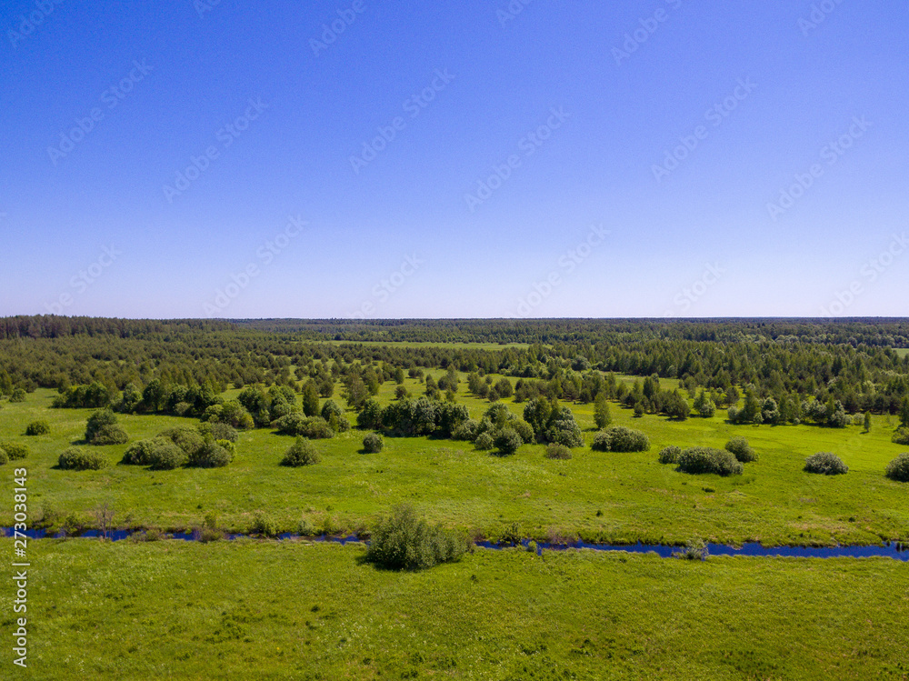 landscape with green field and blue sky landscape with green field and blue sky