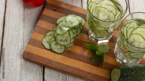 Cucumber water, cleansing water to detoxify the body and quench thirst on a white background.