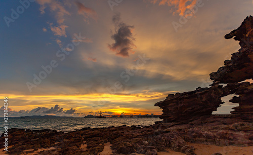 sunset above industry pier at Kwang beach.there have beautiful rock along the beach. Kwang beach is quiet and beautiful beach in Krabi