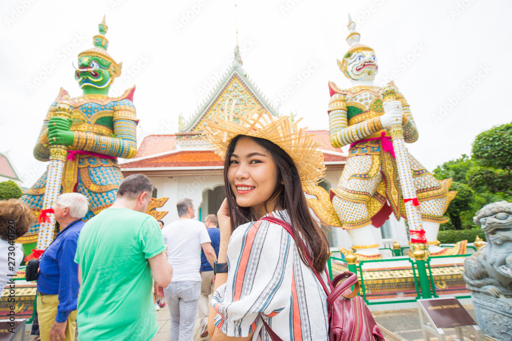Fototapeta premium Asian backpack tourost women travel in temple of buddism