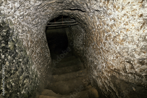 Deep hall with steps mined to the rock