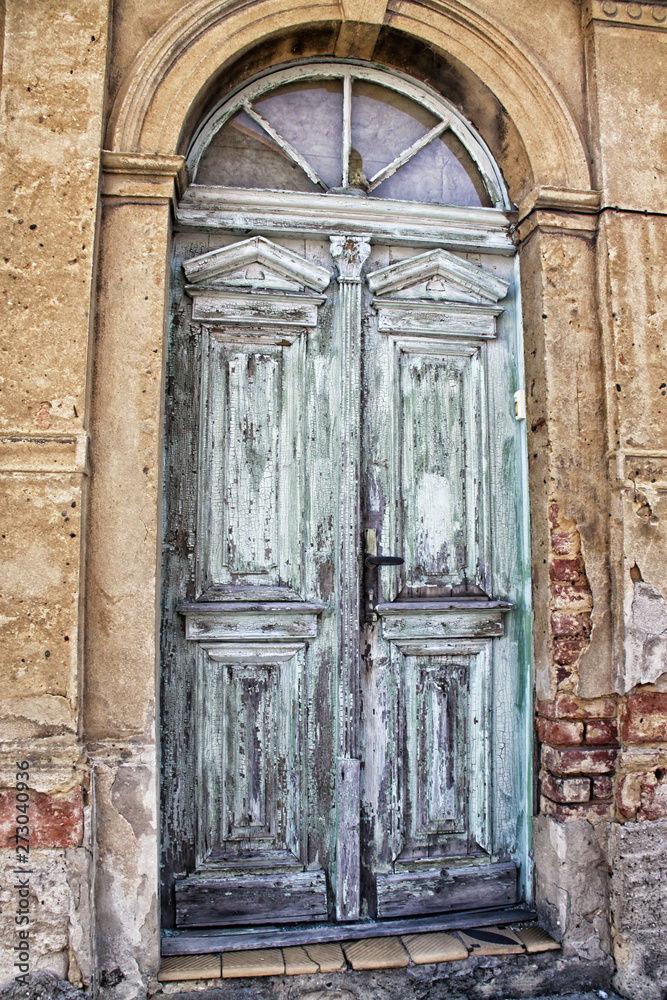 Old cracked green and blue wooden portal
