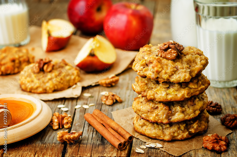 apples oats cinnamon cookies on a wood background apples oats cinnamon cookies on a wood background