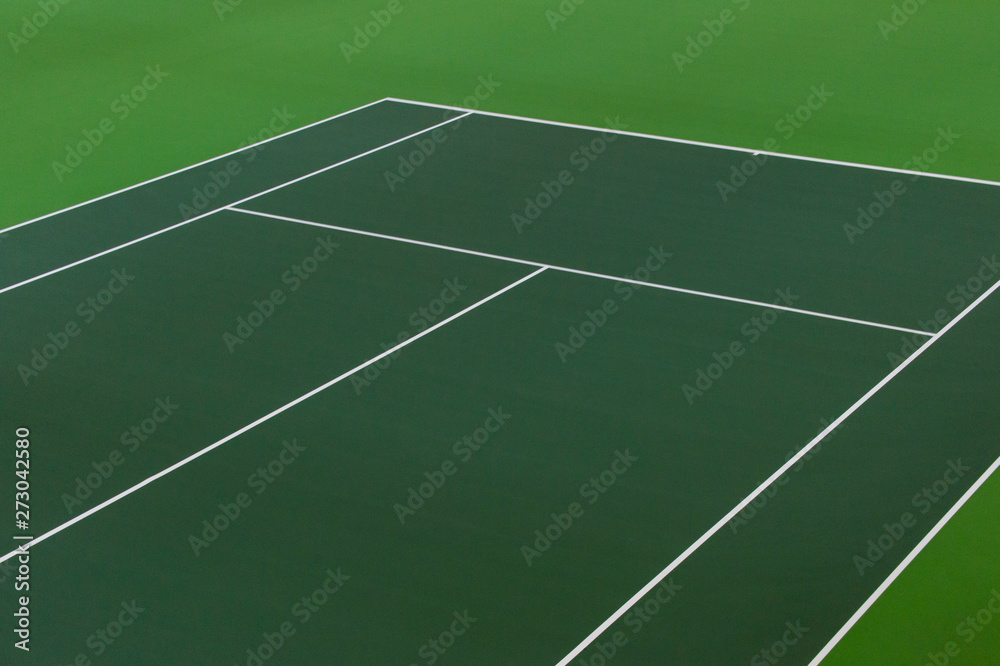 White lines of tennis courts on green floor background and have copy space for design backdrop in your work