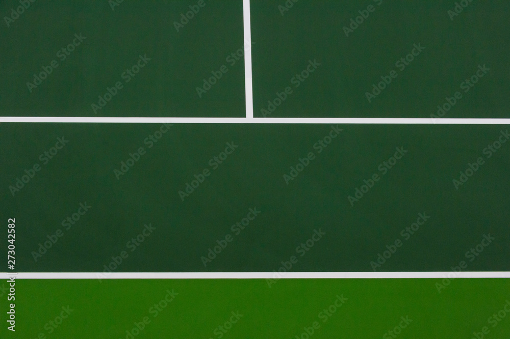 White lines of tennis courts on green floor background and have copy space for design backdrop in your work White lines of tennis courts on green floor background and have copy space for design backdrop in your work