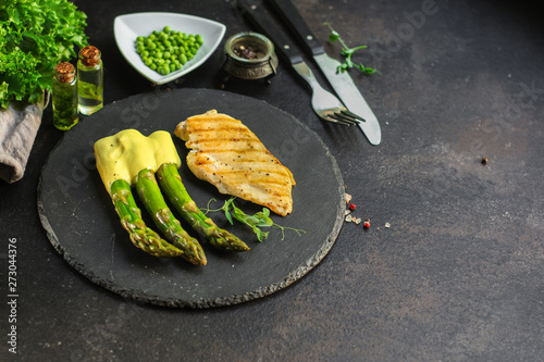 asparagus and meat fillets grill, hollandaise sauce. food background. top