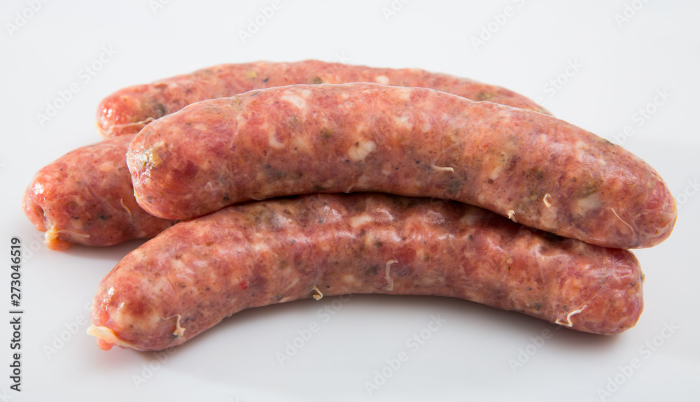 Appetizing uncooked meat sausages
