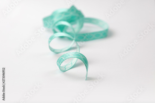 turquoise silk ribbon with on white background