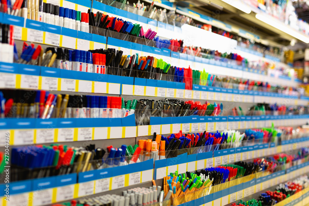Colorful pen shelves in office supply store
