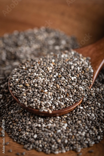 dried chia seeds on wood spoon