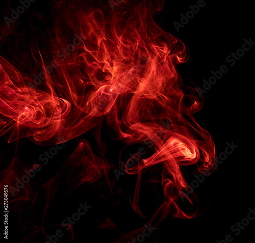 Red smoke on black background