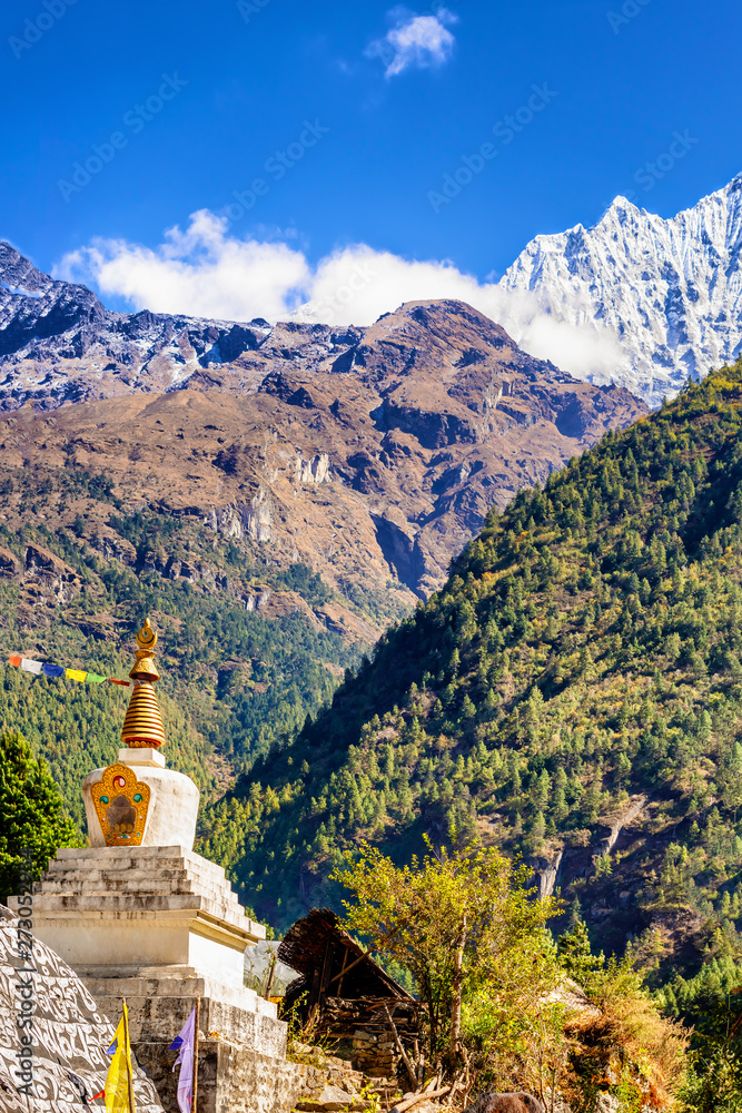 Stupa and the prayer rock and mountains on Everest Base Camp Trek in Nepal.