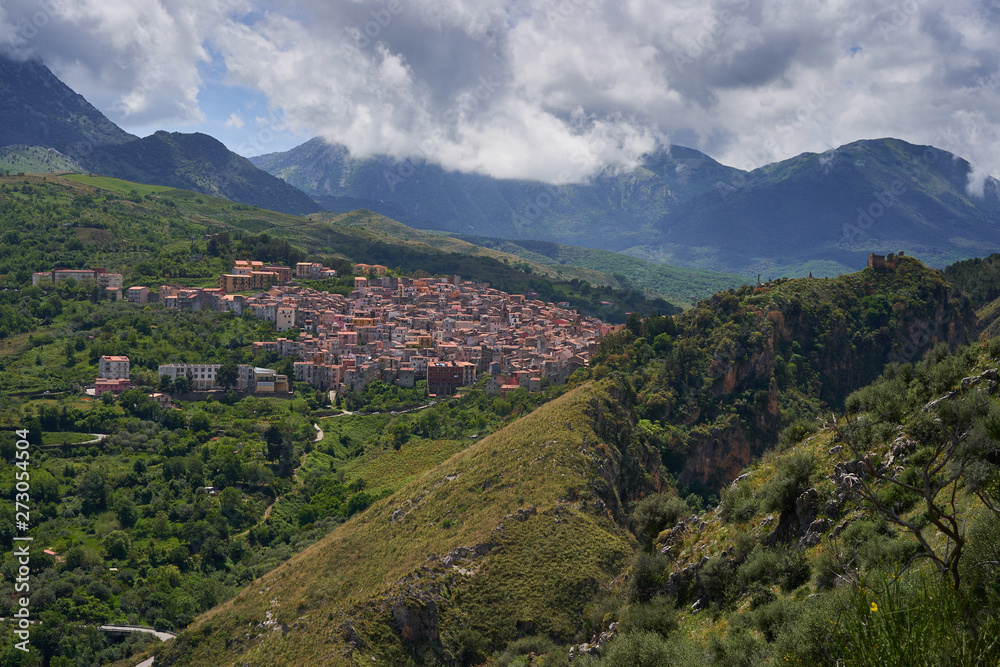 Landscape Picture of beautiful small mediaeval town or village Isnello to be located in Madonie mountain range in Italy in Palermo Province of island Sicily. Picture is taken in cloudy spring day.