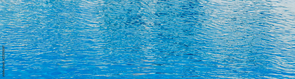 blue water texture in a pool, closeup