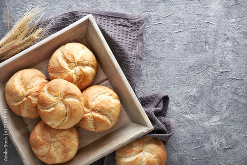 Crusty round bread rolls, known as Kaiser or Vienna rolls on linen towel photo