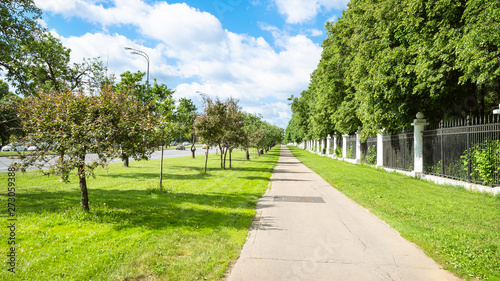 lawn with apple trees and pathway along garden