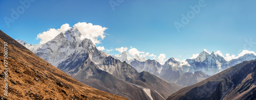 Scenic valley and Himalayan mountains peaks on trek between Tengboche and Lobuche, Nepal.