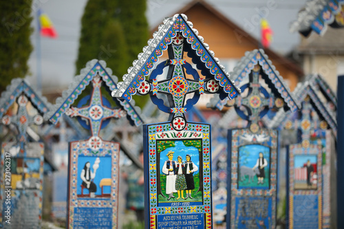 Vivid painted wooden tombstones at Merry Cemetery, Famous graveyard in Sapanta, county of Maramures, Romania photo