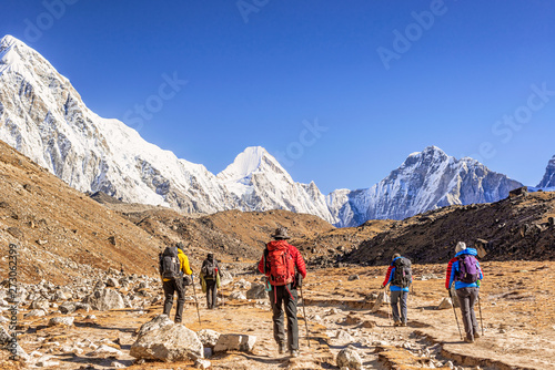 Himalayan mountains peaks and trekkers on the Everest Base Camp trek, Nepal photo