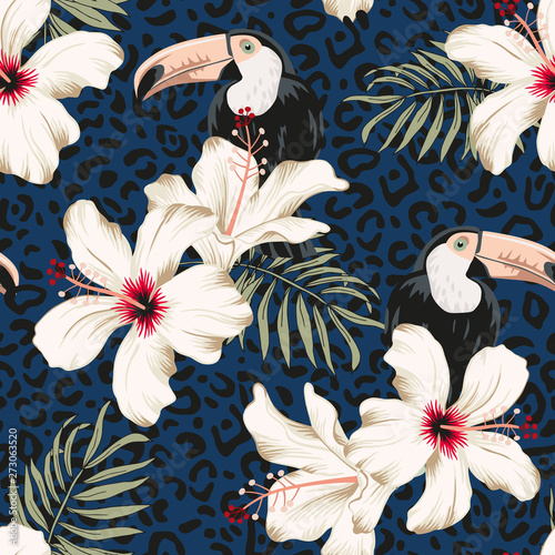 Toucans, hibiscus flowers, palm leaves, leopard skin texture navy background. Vector floral seamless pattern. Tropical illustration. Exotic plants, birds. Summer beach design. Paradise nature