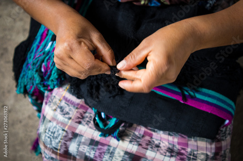 Woman's Hands Working on Handmade Textile in Guatemala