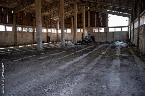 Ruined abandoned industrial factory hall of warehouse or hangar