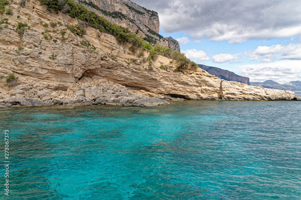 Sailboat off the coast of Sardinia - Italy Sailboat off the coast of Sardinia - Italy