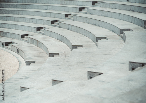 Fotobehang Rows of grayish stony or marble seats and flights of stairs of a modern outdoor