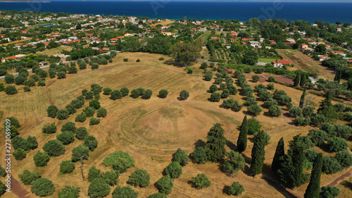 Aerial photo of archaeological site and monument of world famous Marathon tomb in the place of the historical battle between Athenians and Persians in city of Marathonas, Attica, Greece photo