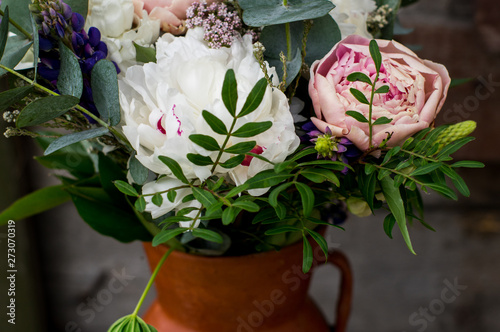 Fototapeta Naklejka Na Ścianę i Meble -  Bouquet with pink and white peonies in the jar