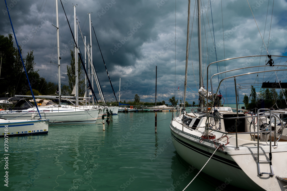 Modern Sailboats In Harbor At Stormy Weather