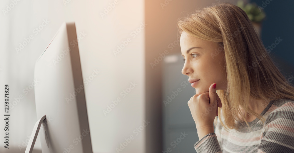 Young attractive woman working with a computer Young attractive woman working with a computer