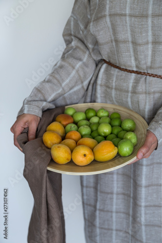 Fototapeta Naklejka Na Ścianę i Meble -  plum and apricot fruits in the wooden plate for food photography concept or healthy life.