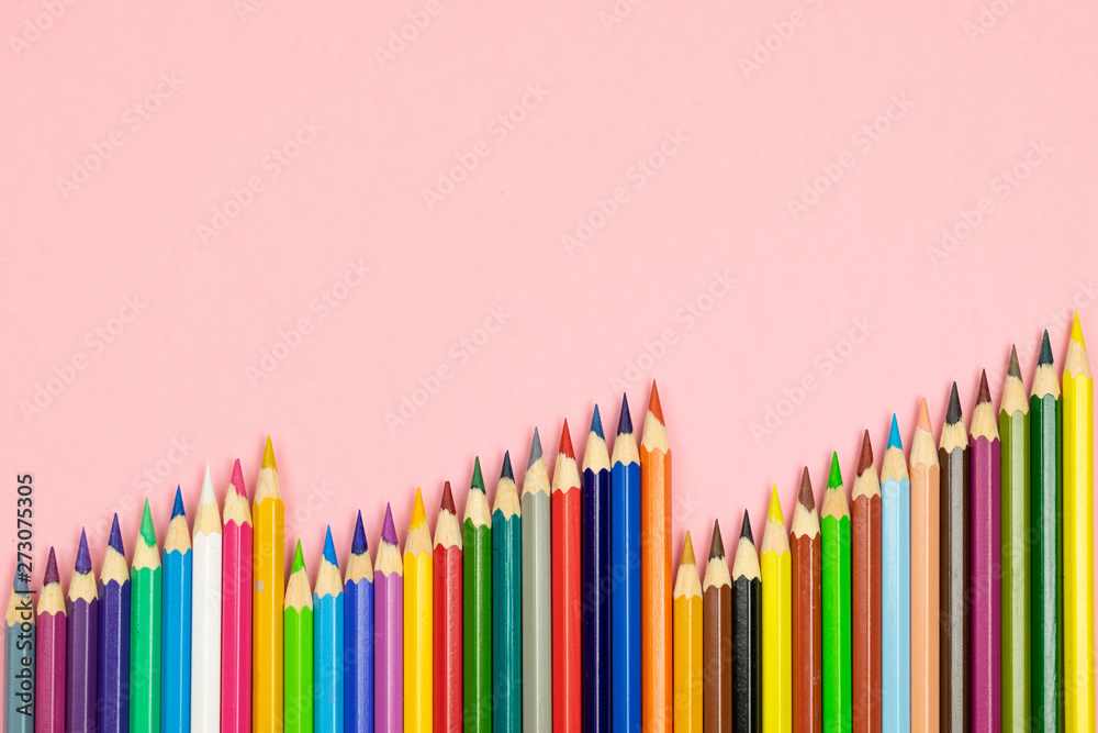 Close up of color pencils on pink background with clipping path. Education frame concept. Close up of color pencils on pink background with clipping path. Education frame concept.
