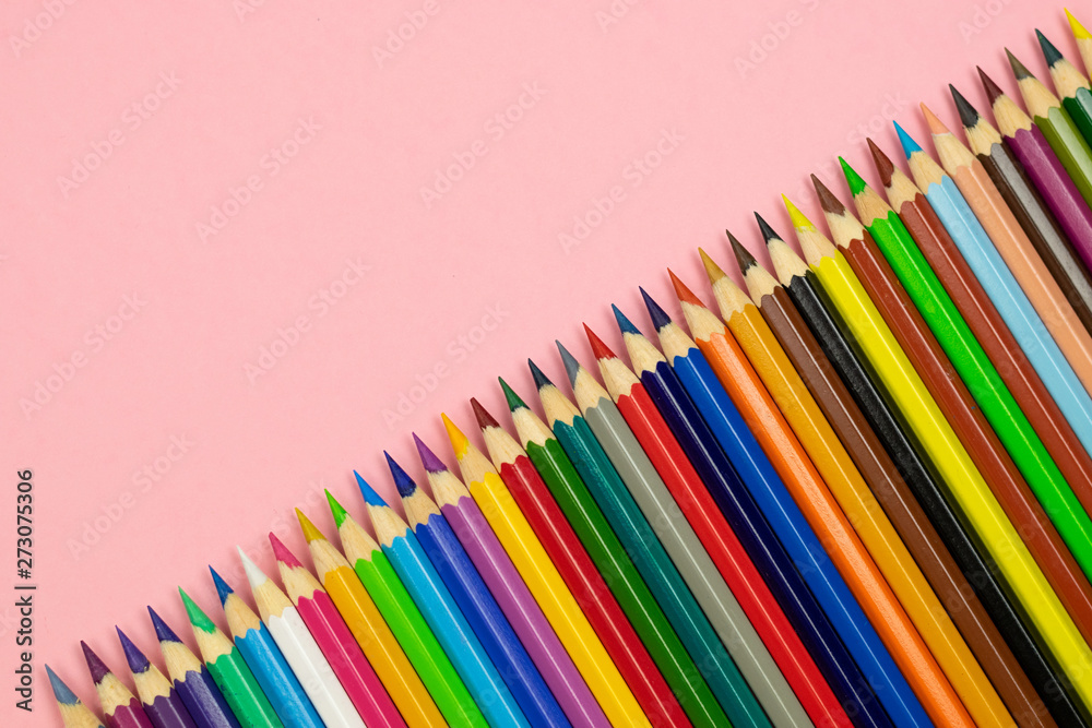 Close up of color pencils on pink background with clipping path. Education frame concept. Close up of color pencils on pink background with clipping path. Education frame concept.
