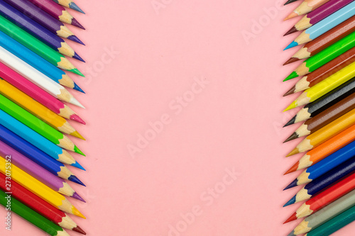 Color pencil with copy space isolated on pink background. Education frame concept.