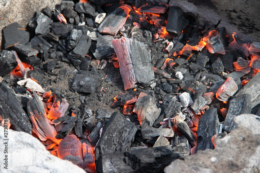 Charcoal burning in the grill. The fire in the grill. Kindle fire. Danger. Cooking. Charcoal burning in the grill. The fire in the grill. Kindle fire. Danger. Cooking.