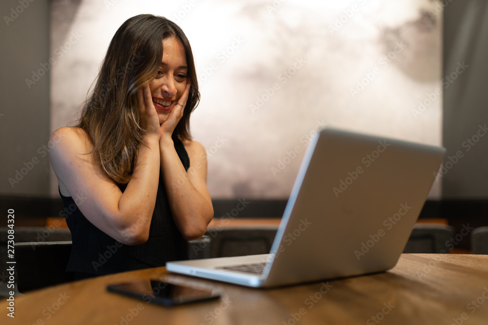Business woman work process concept. Shocked female freelancer stares at laptop computer with bugged eyes, Blurred background, film effect. Business woman work process concept. Shocked female freelancer stares at laptop computer with bugged eyes, Blurred background, film effect.