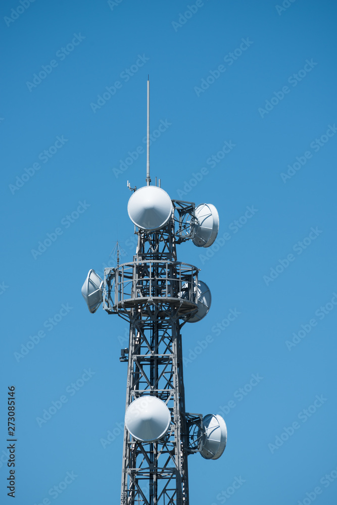 Telecommunication tower against the blue sky Telecommunication tower against the blue sky